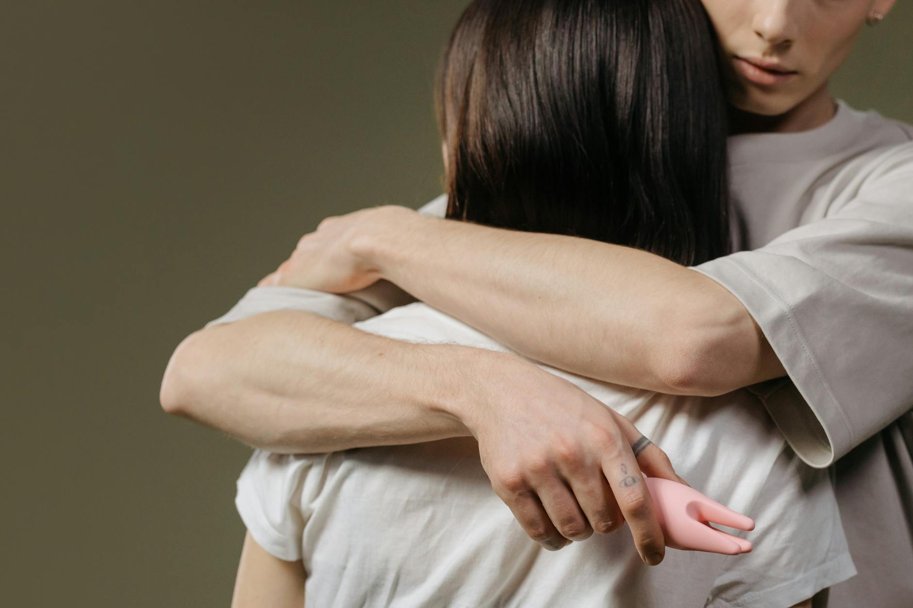 A couple embracing intimately, representing connection and comfort during recovery